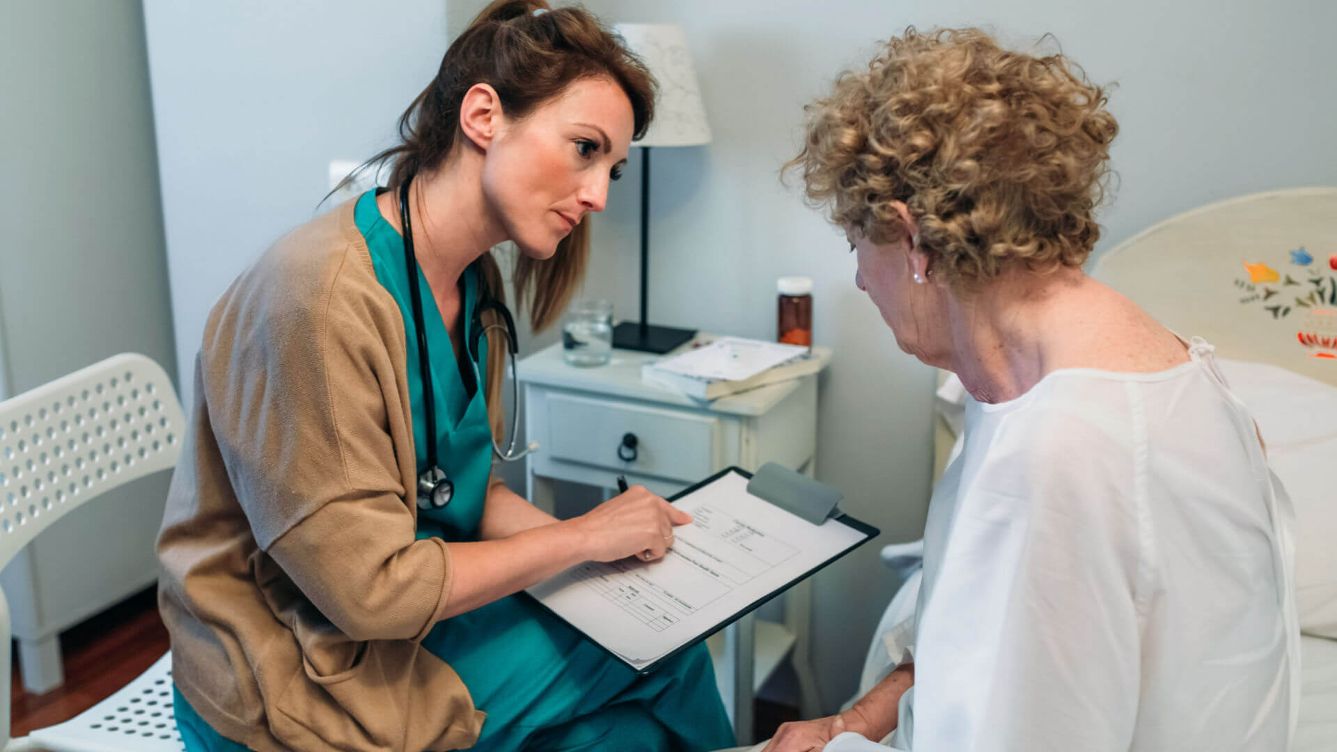 nurse telling woman about informed consent